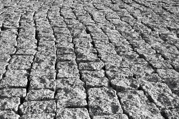 Grey brick stone street road. Light sidewalk, pavement texture