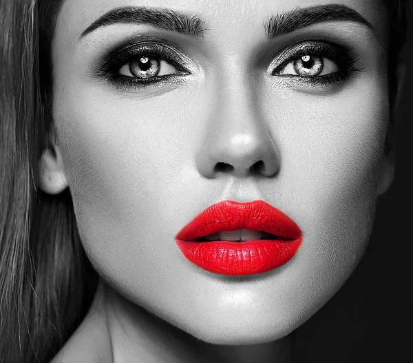 Black and white photo of sensual glamour portrait of beautiful woman model lady with fresh daily makeup with red lips color and clean healthy skin face