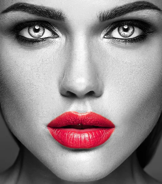 Black and white photo of sensual glamour portrait of beautiful woman model lady with fresh daily makeup with red lips color and clean healthy skin face