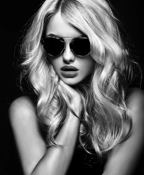 Black and white photo of beautiful cute blonde woman girl in sunglasses