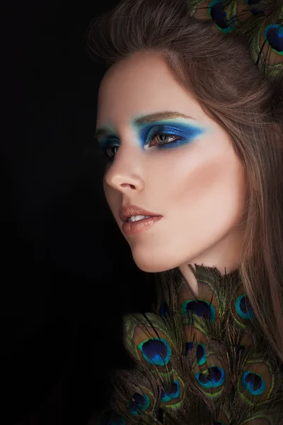 Beautiful Woman with  Colorful Fashion Makeup. Face Closeup