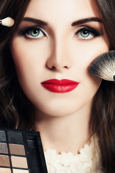 Makeup Beauty concept. Beautiful Woman with Make-up Brushes and