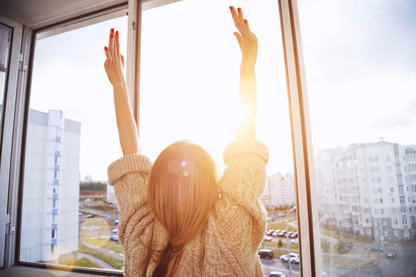 Woman raising hands