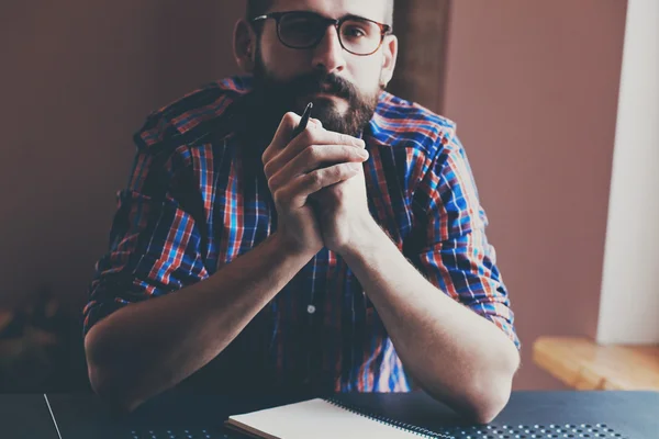 Man with pen and notebook