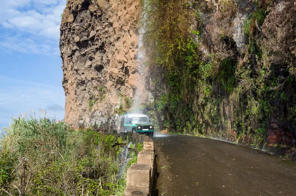 Extreme natural waterfall car wash in the rocks of Madeira