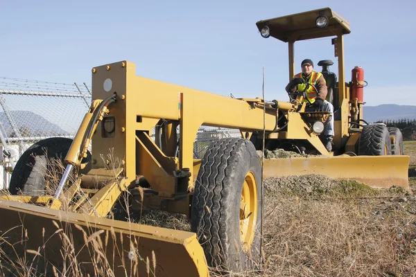 Grader and Operator