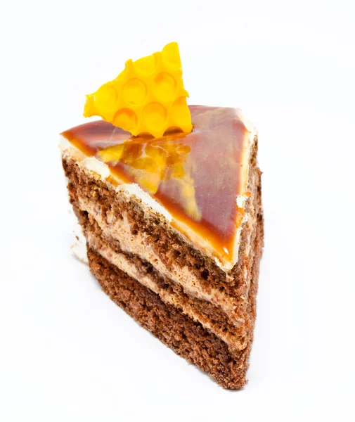 Piece of honey cake isolated on a white