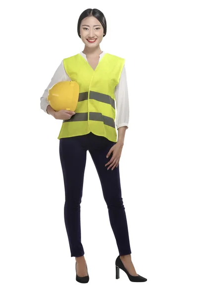 Businesswoman with hard hat and safety vest