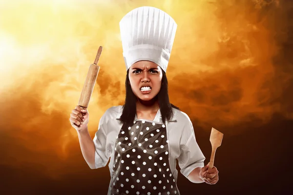 Angry asian woman chef