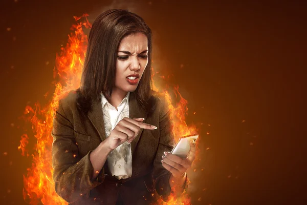 Angry businesswoman using cellphone