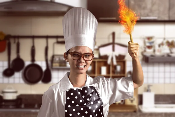 Angry asian woman chef