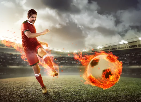 Football player kicking  fire ball
