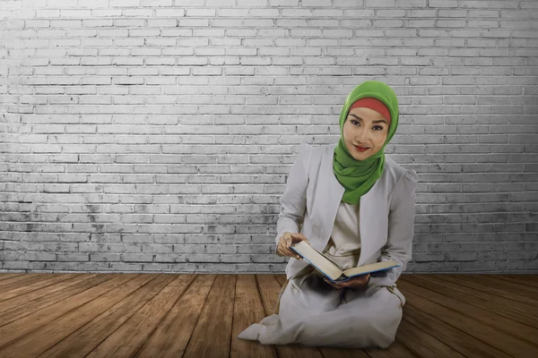 Asian muslim woman reading the koran