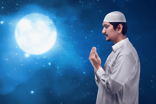Asian muslim man praying to god