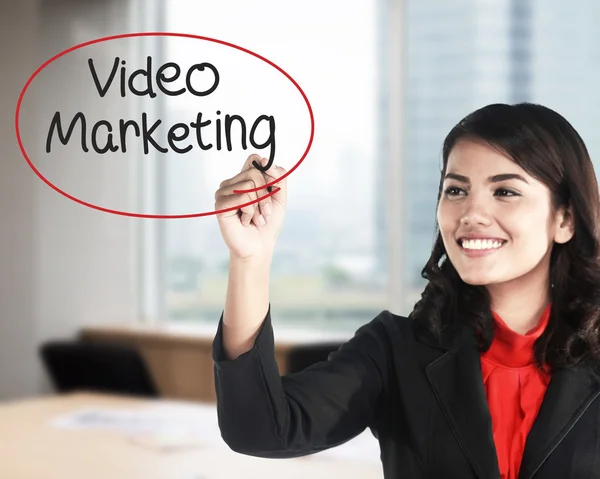 Business woman writing video marketing