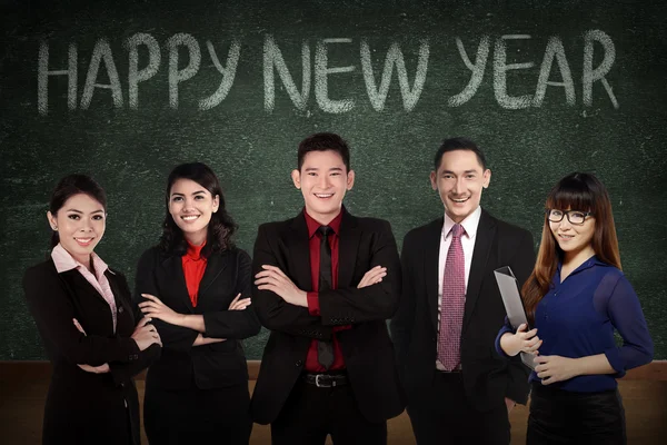 Business team in front of happy new year