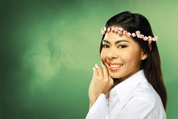 Asian woman wearing flower headband