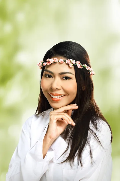 Asian woman wearing flower headband