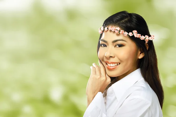 Asian woman wearing flower headband