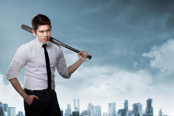 Businessman holding baseball bat
