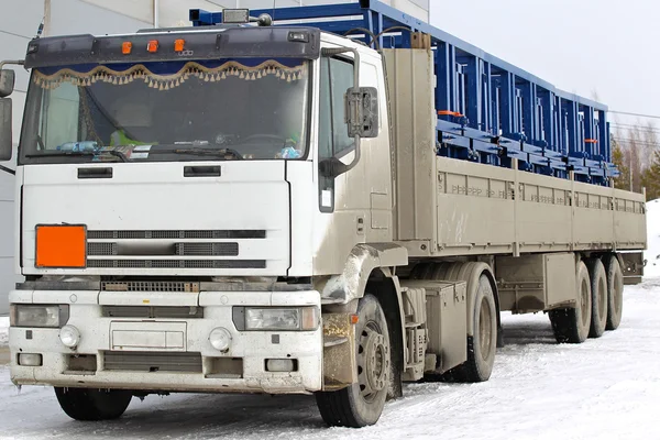 Truck loaded with metal structures