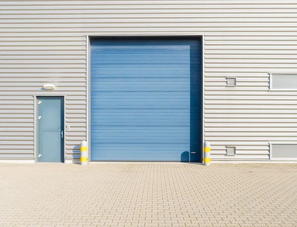 Industrial warehouse with blue roller door