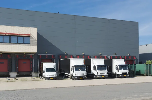 Trucks at warehouse building