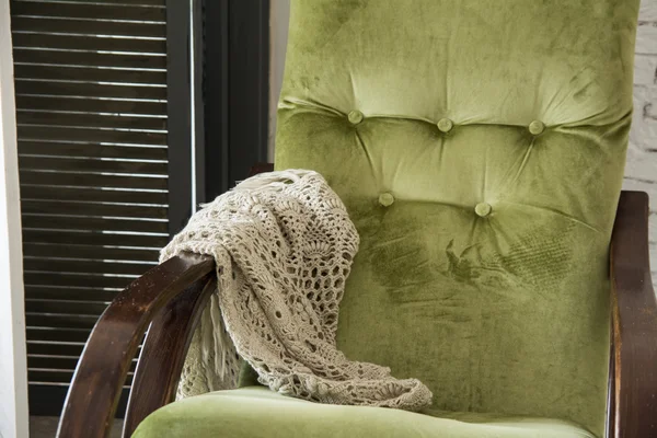 Close-up of a green rocking chair