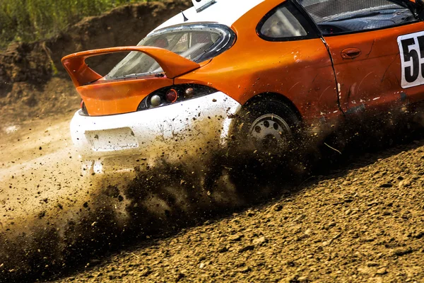 Autocross on a dusty road.