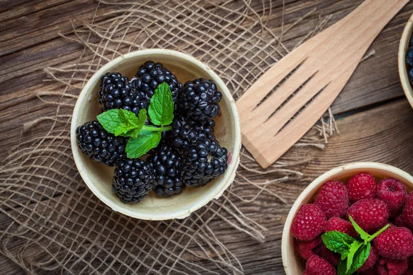 Blackberries, raspberries and blueberries in a waffle bowls.