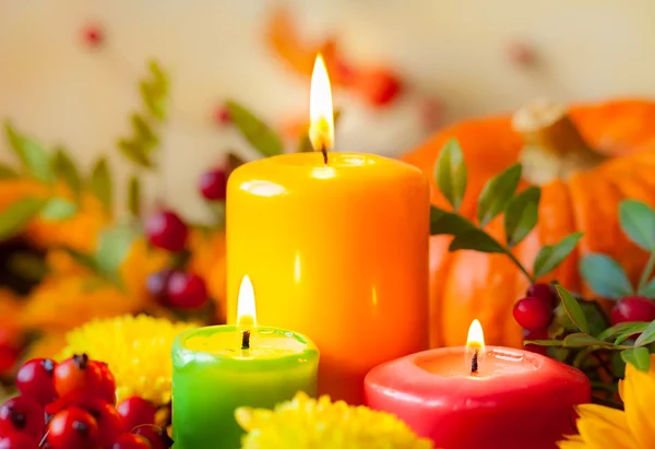 Burning colorful candles and flowers