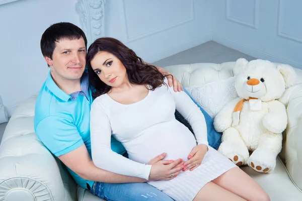 Pregnant family, young happy couple expecting a baby.