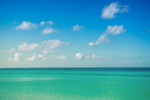 Calm sea, ocean and blue cloudy sky. Horizon. Picturesque Seascape