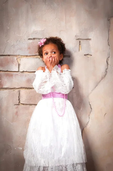 Little actress. Beautiful african  girl shows emotions: fear, fright, surprise