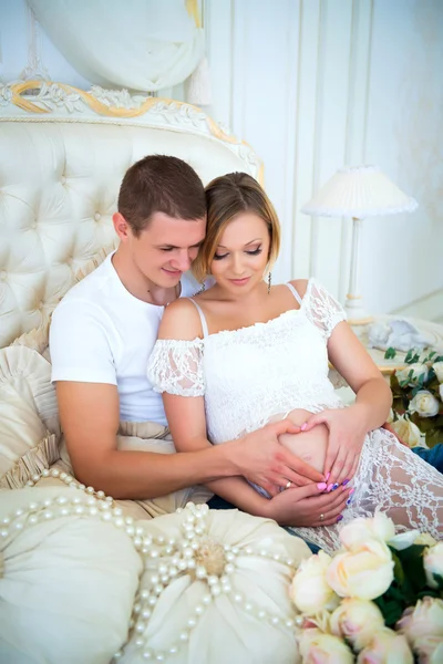 Happy pregnant family waiting for baby. Pregnancy and love for the child