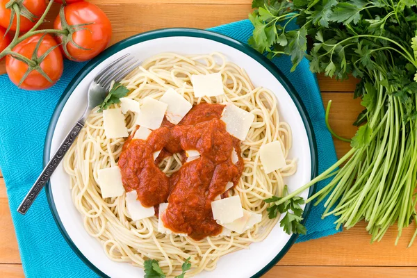 Pasta with red sauce and grana padano cheese