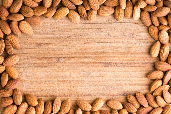 Rectangular border or frame of fresh almonds