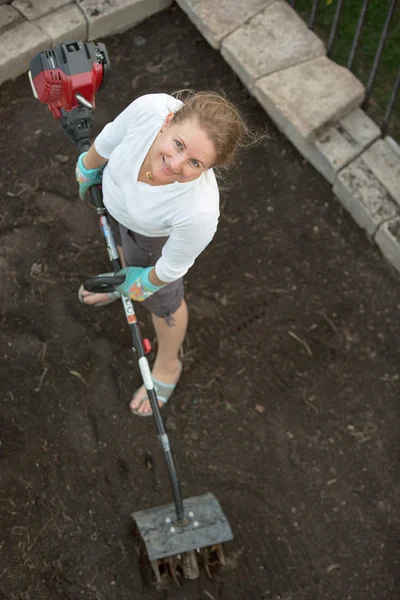 Attractive middle-aged woman gardening