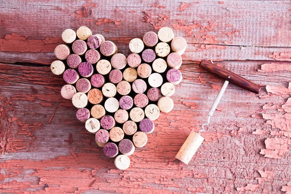 Corks in Heart Shape and Bottle Opener on Table