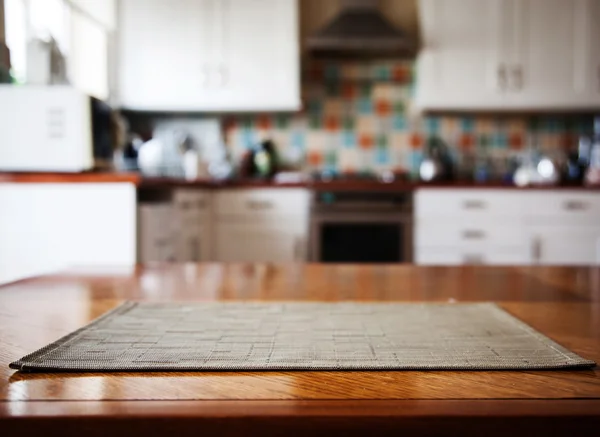 Blurred kitchen interior and napkin and desk space