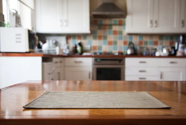 Blurred kitchen interior and napkin and desk space