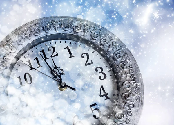 New Year's at midnight - old clock in snow