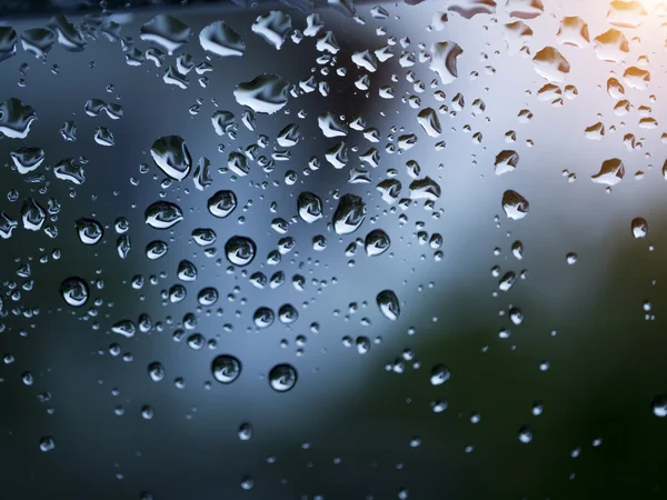 Raindrops on window glass, background