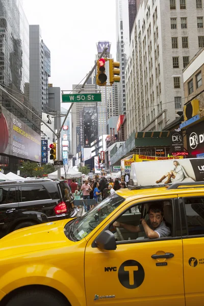 New york city, 12 september 2015: yellow cab and many people nea