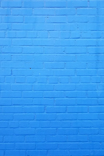 Vertical part of blue painted brick wall