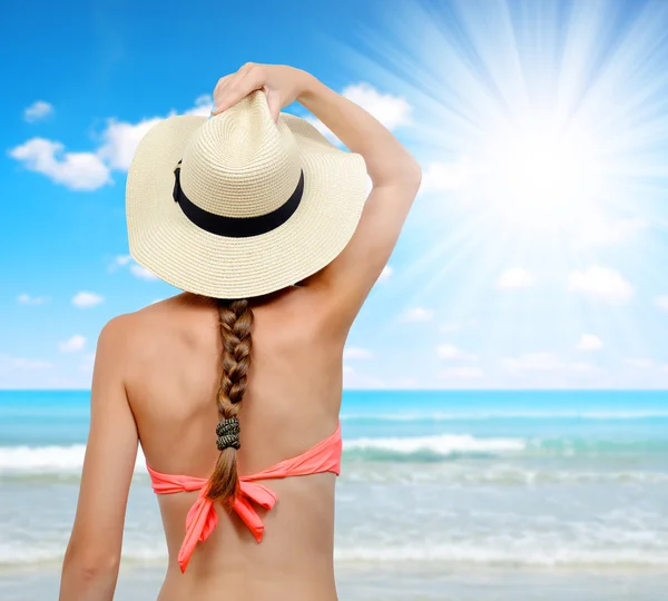 Woman with sun hat and bikini