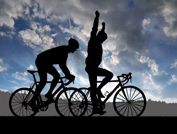 Silhouette of two cyclists