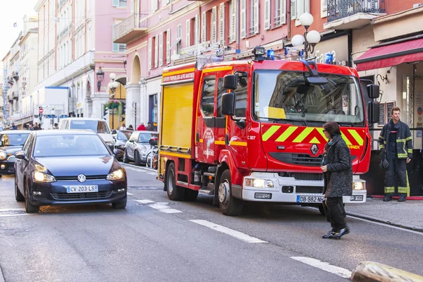 NICE, FRANCE, on JANUARY 7, 2016. City landscape, winter day. The fire truck has stopped near the sidewalk