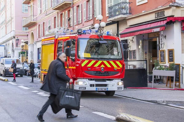 NICE, FRANCE, on JANUARY 7, 2016. City landscape, winter day. The fire truck has stopped near the sidewalk