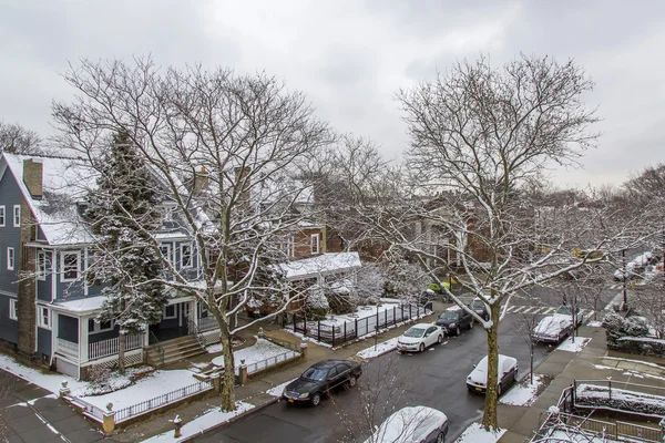 NEW YORK, USA, on MARCH 4, 2016. A house view from the window in Brooklyn on the street and trees covered with snow. Winter landscape.